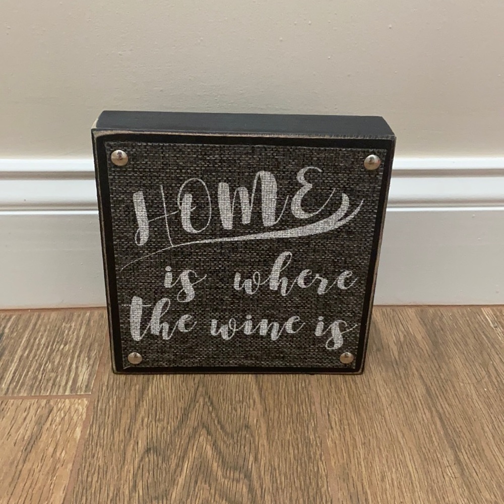 “Home is where the wine is” sign
